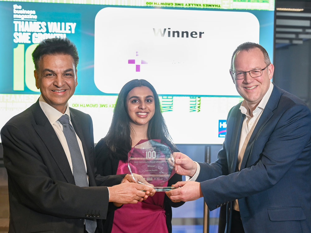 Dr Bippon Vinayak and Monisha Vinayak of Square Health accepting the award from a judge.